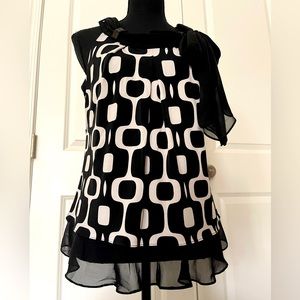 Beautiful sleeveless tops with bottom ruffles/scarf.